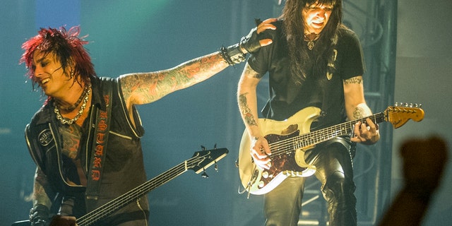  Nikki Sixx and Mick Mars of Motley Crue perform on July 15, 1999.