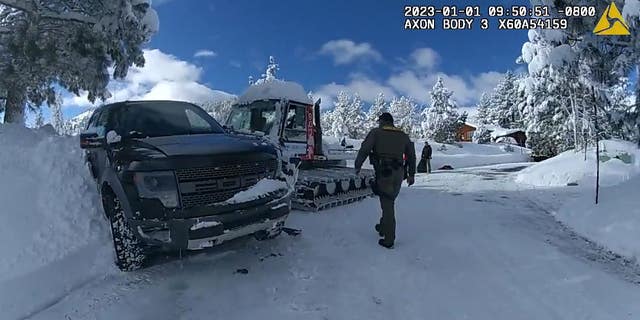 Officers walk through scene of Jeremy Renner's snowplow accident on New Year's Day in Lake Tahoe.