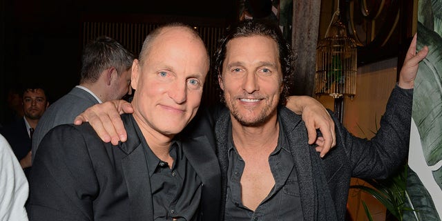 Woody Harrelson and Matthew McConaughey embracing