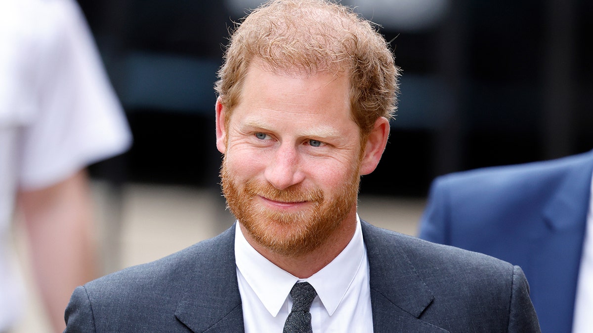 A close-up of Prince Harry in a suit