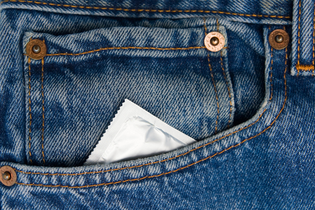 Condom in the pocket of a blue jeans