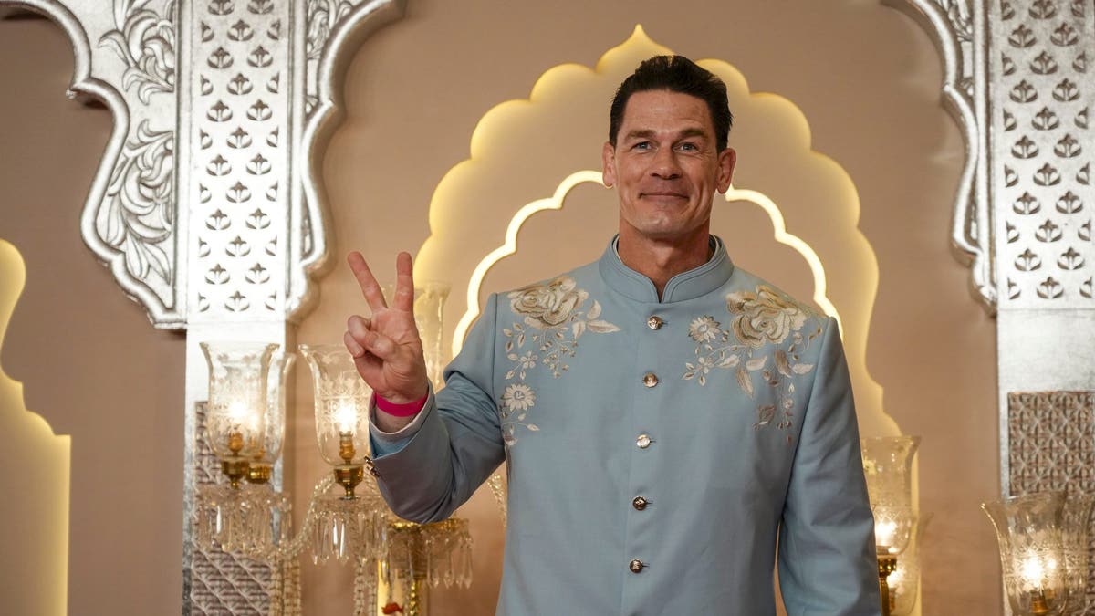 john cena flashing peace sign at indian wedding