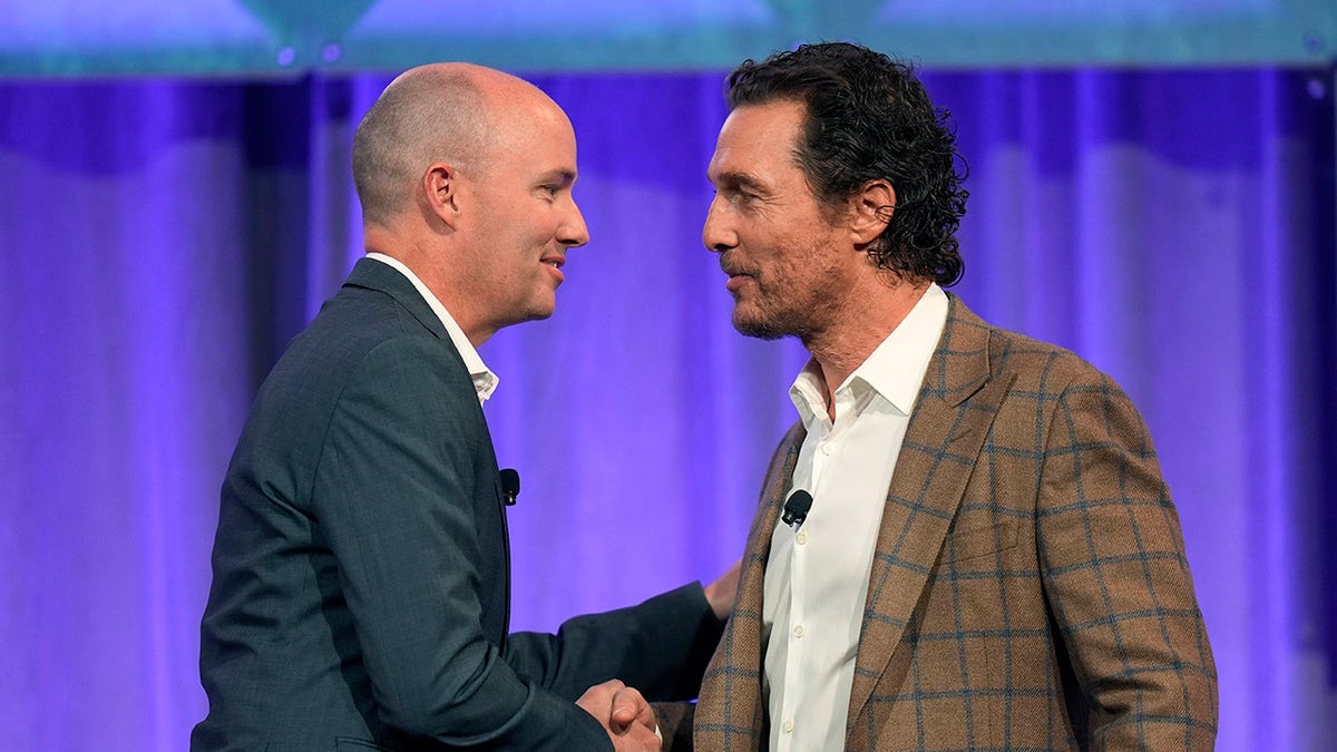 Matthew McConaughey shakes hands with Utah Gov. Spencer Cox