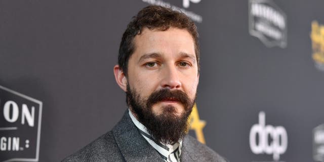 Shia LaBeouf poses on red carpet