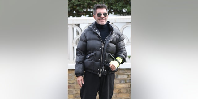 Simon Cowell broken arm