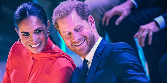 Prince Harry has been confirmed to attend his father's coronation, while Meghan will stay home with their children, Archie and Lilibet.