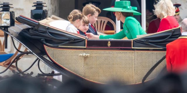 Princess Kate fixing Prince Louis