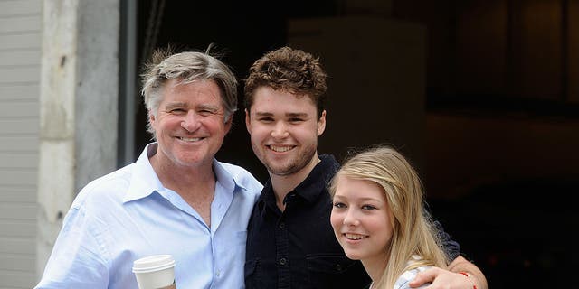 Treat Williams smiling with son and daughter