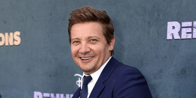 Jeremy Renner smiles at his first red carpet appearance since his accident.