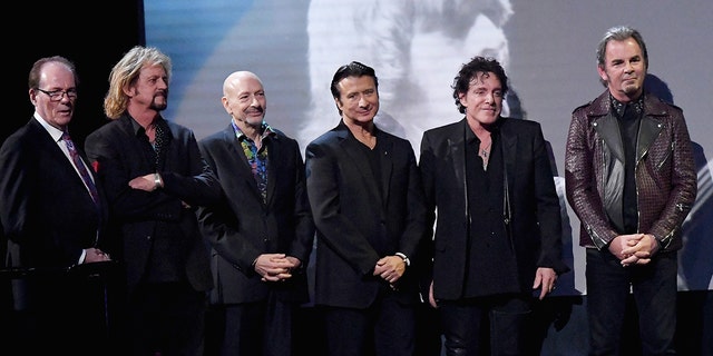 Aynsley Dunbar and the rest of Journey at the Hall of Fame ceremony