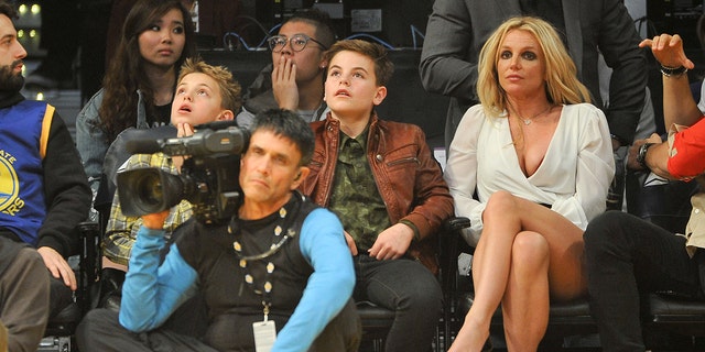 Britney Spears with two sons at basketball game