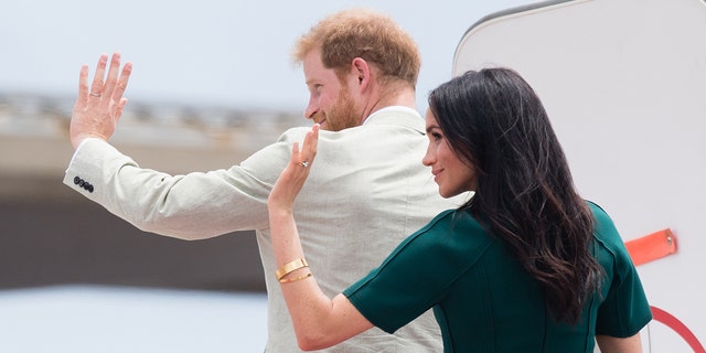 Meghan Markle and Prince Harry wave