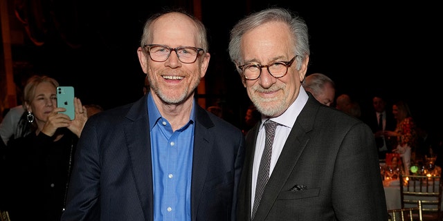 Ron Howard and Steven Spielberg standing next to each other at a public event