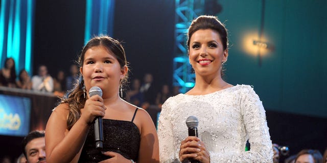 Madison De La Garza and Eva Longoria in 2011.