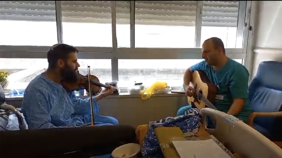 Sgt. Mordechai Shenvald playing violin