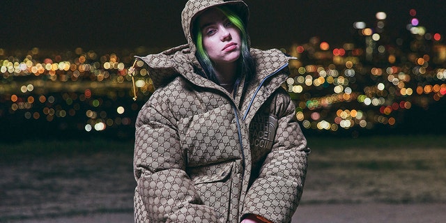 Billie Eilish wearing an oversized puffy jacket