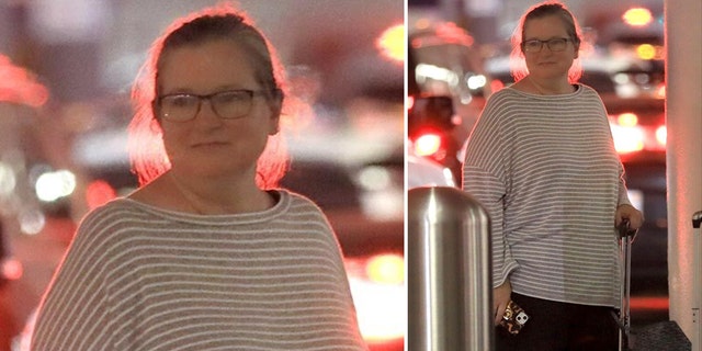 Bridget Fonda waits for a car service outside of LAX in Los Angeles