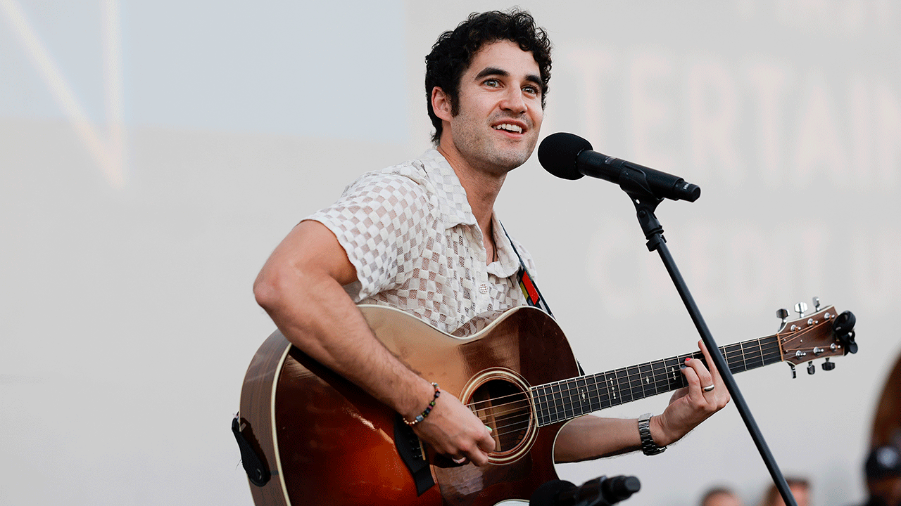 Darren Criss performs at event