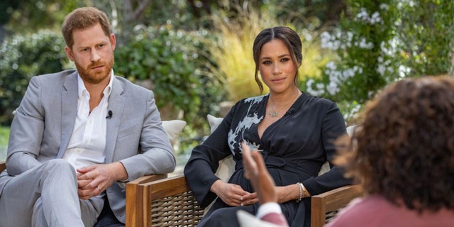 Prince Harry and Meghan Markle being interviewed by Oprah