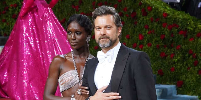 Jodie Turner-Smith embracing Joshua Jackson