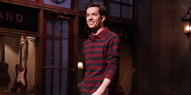 John Mulaney wears red plaid shirt while hosting Saturday Night Live