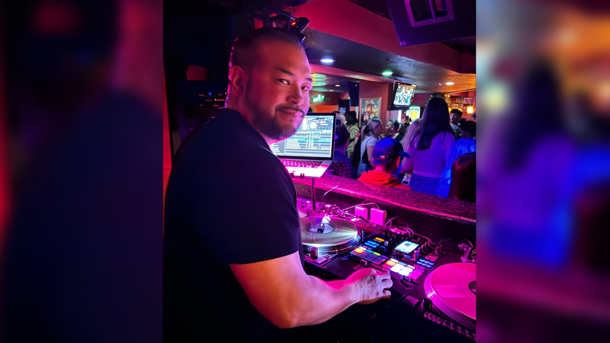 Reality star Jon Gosselin spins music at turntable.