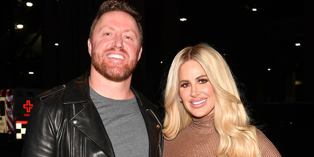 Kim Zolciak wears nude bodysuit, Kroy Biermann sports grey shirt and leather jacket