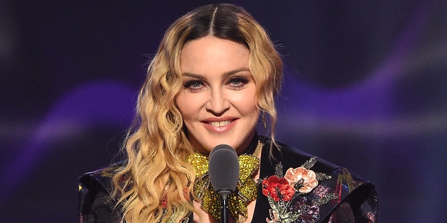 Madonna wears colorful suit on stage