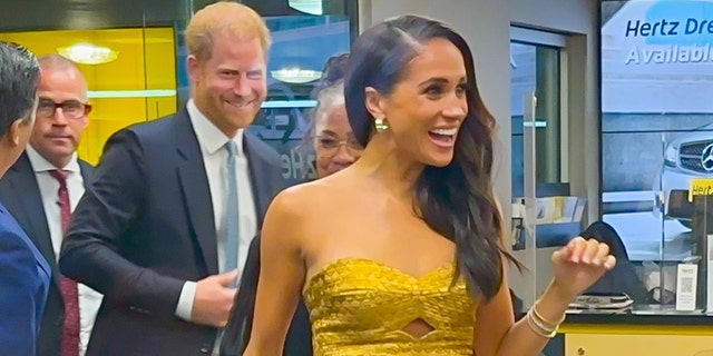 Meghan Markle flashes a smile ahead of feminist event in New York