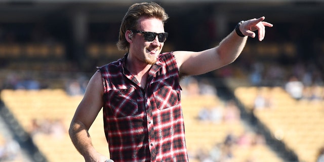 Morgan Wallen wears cutoff flannel shirt at Dodgers stadium