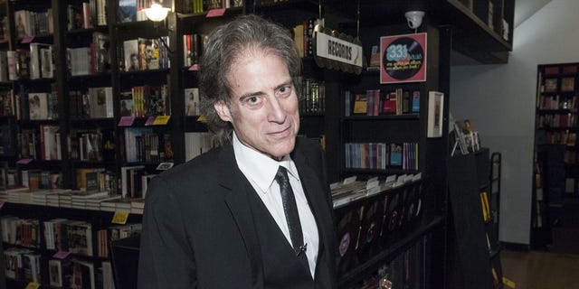 Richard Lewis poses at a book signing